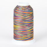 Multicolored variegated thread on white cone with rainbow stripes in yellow, red, blue, green, and purple