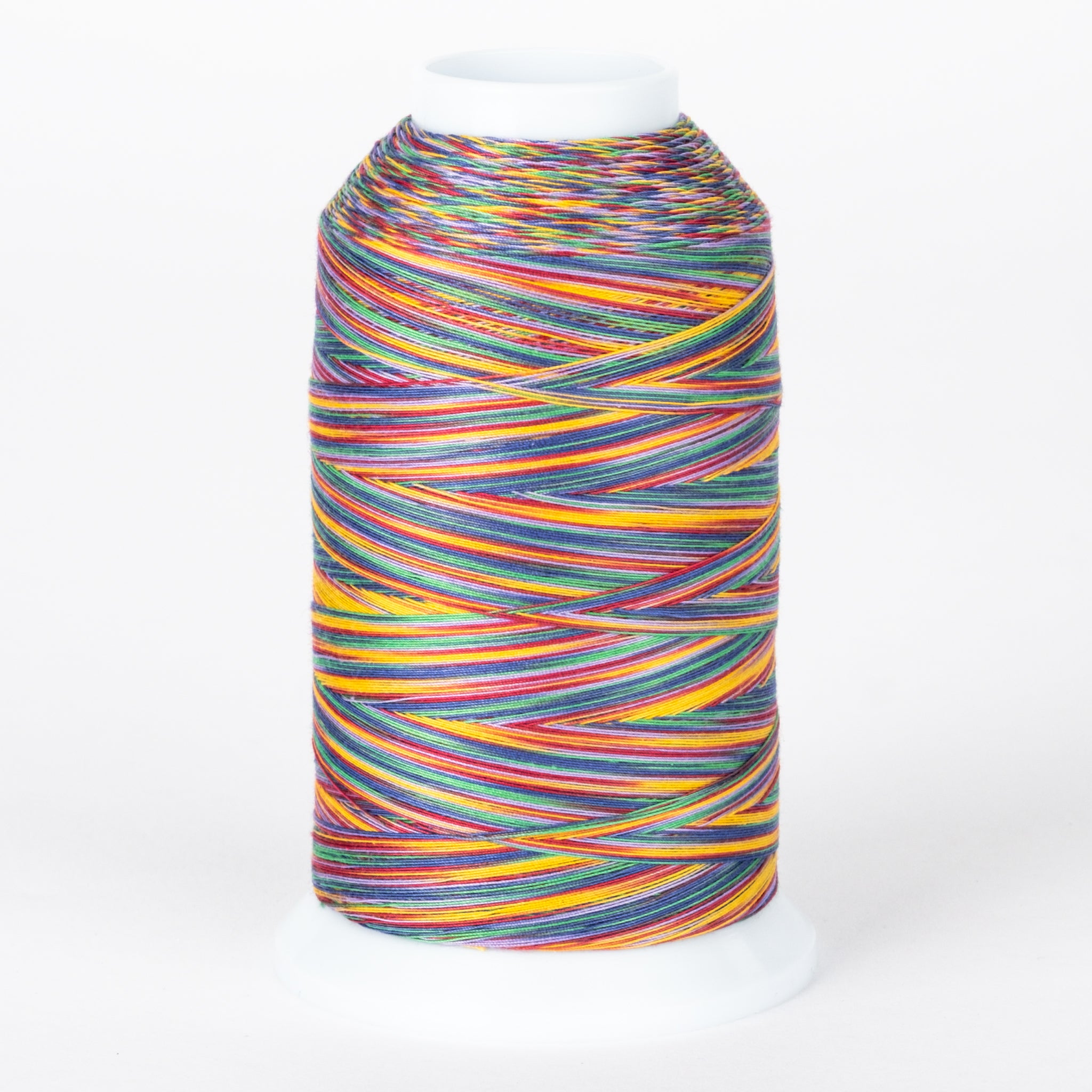 Multicolored variegated thread on white cone with rainbow stripes in yellow, red, blue, green, and purple