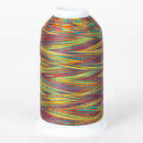 Multicolored variegated thread on white cone spool with rainbow stripes in orange, blue, yellow, red, and green