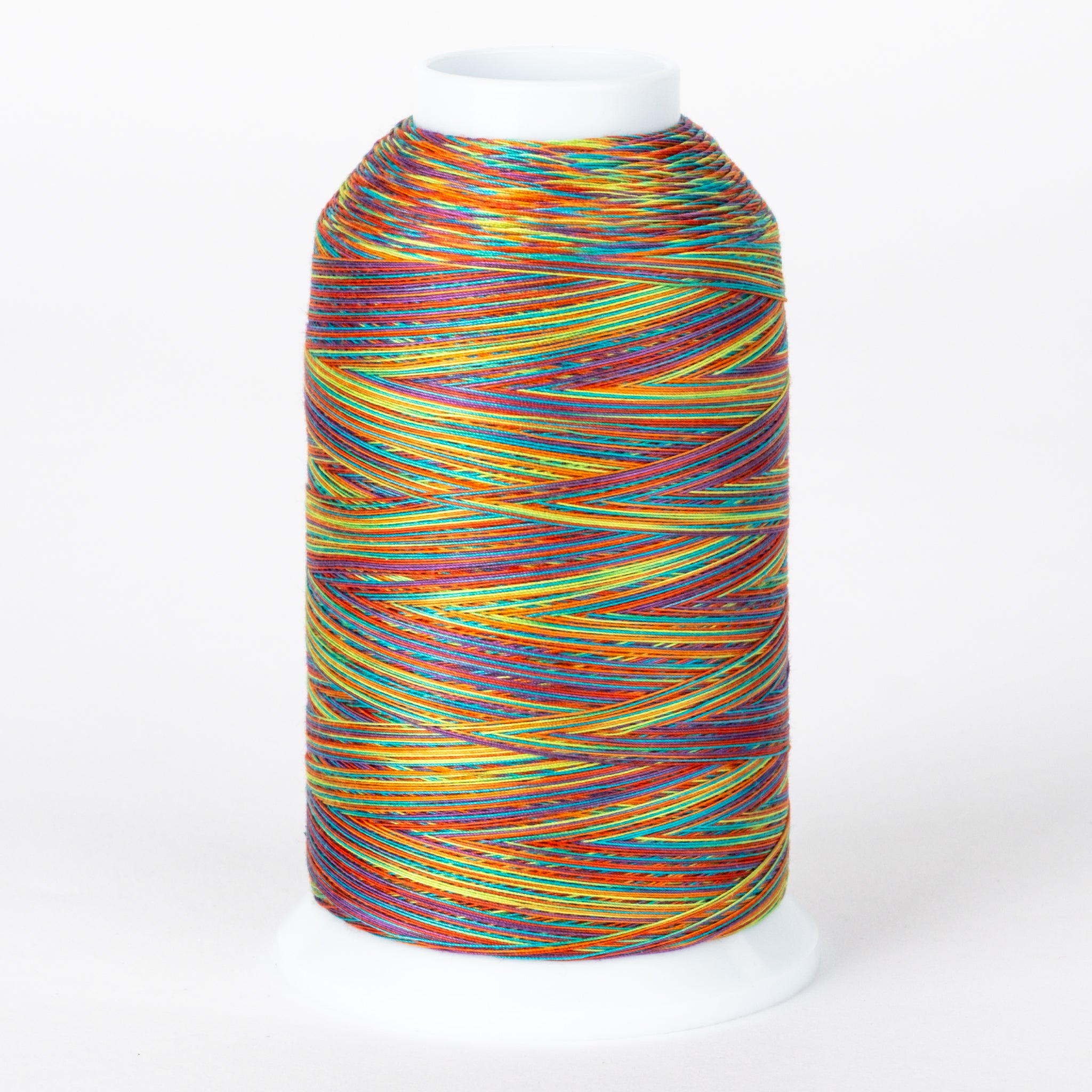 Multicolored variegated thread on white cone spool with rainbow stripes in orange, blue, yellow, red, and green