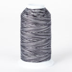 Zebra striped variegated thread on white plastic cone with black and white alternating pattern throughout