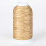 Tumbleweed variegated thread on white cone, showing golden brown and cream twisted strands