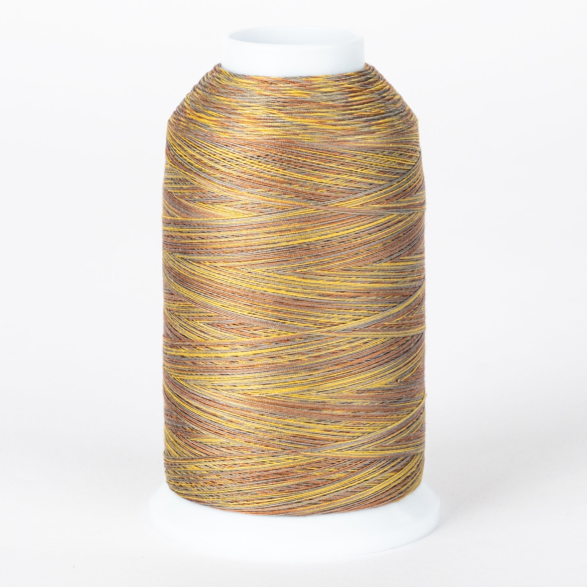 Variegated golden yellow and brown thread on white cone spool with multicolored strands wound in diagonal pattern