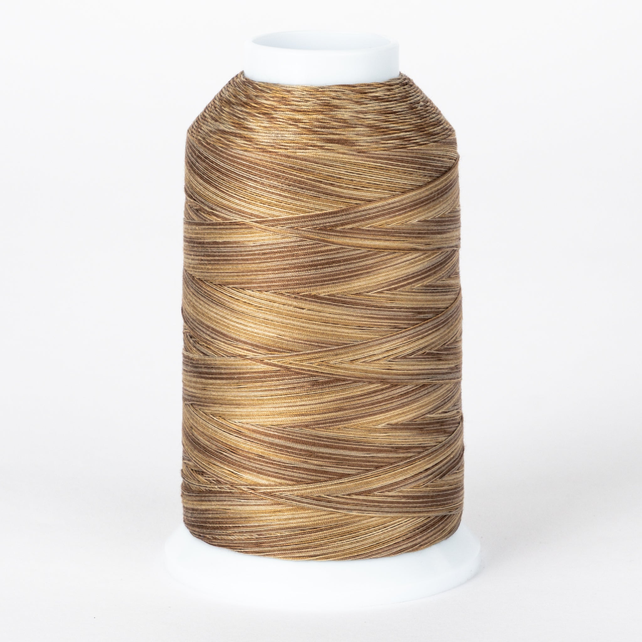 Barnwood variegated thread on white cone, showing brown and tan multicolored strands wound in diagonal pattern