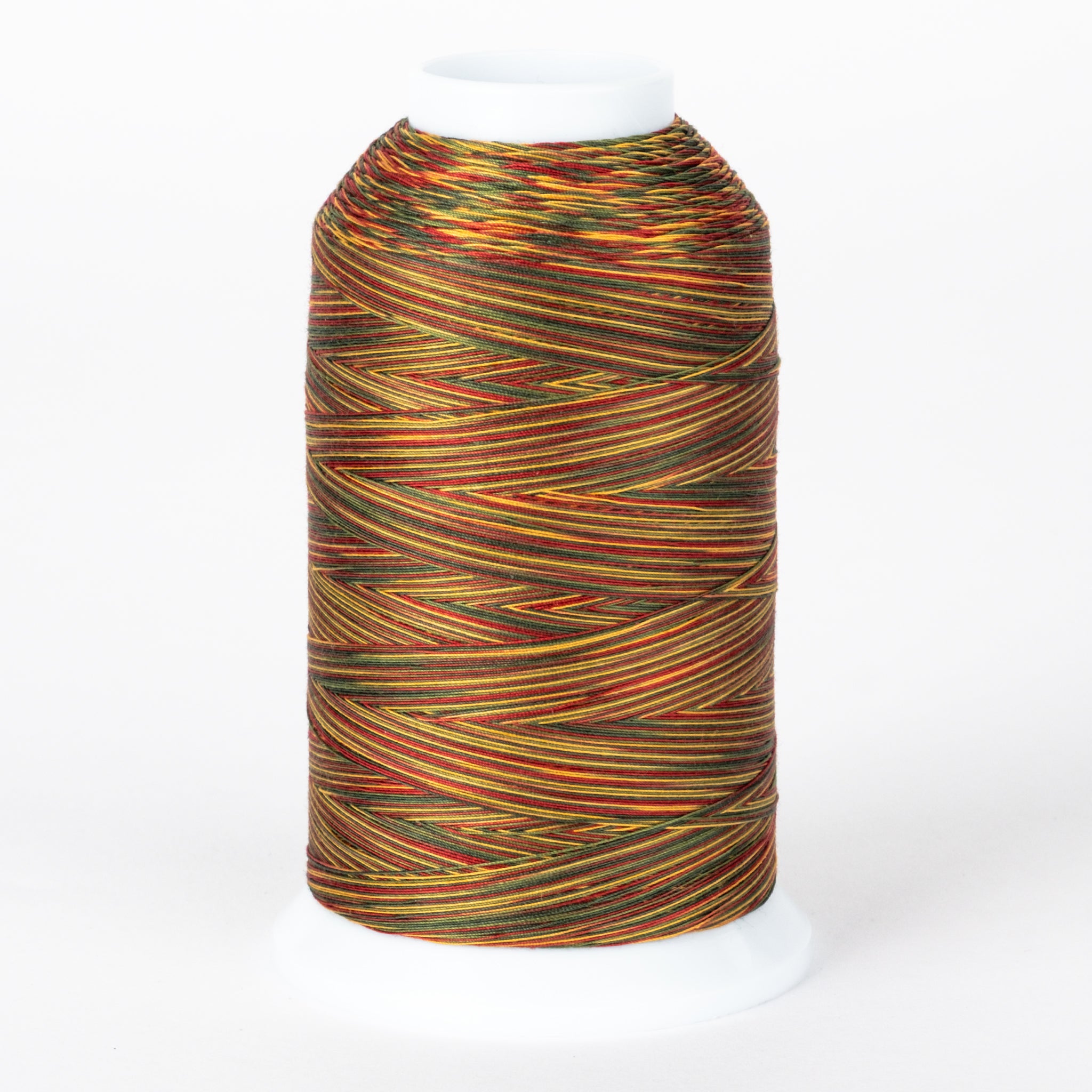 Christmas Gold variegated thread on white cone, featuring red, gold, and green multicolored strands wound in crossing pattern