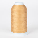 Almond colored thread wound on white plastic cone with clear protective cap