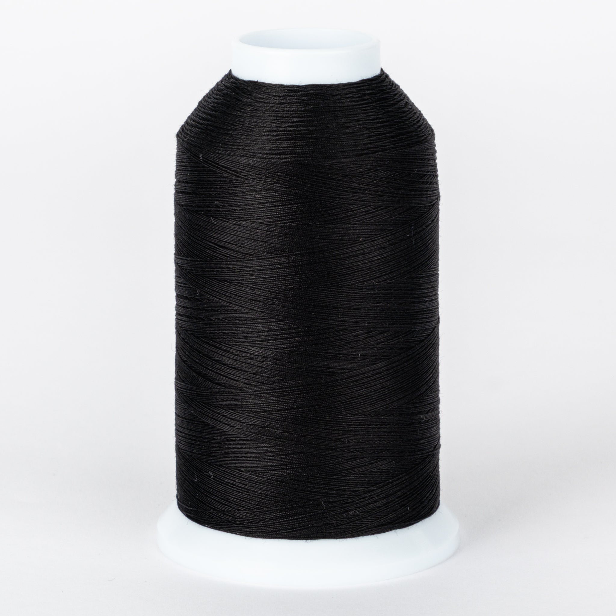 Black thread wound on white plastic cone spool with neat, even thread wrapping