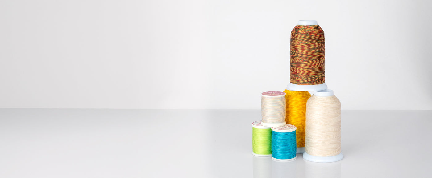 cones and spools of majestic with white background