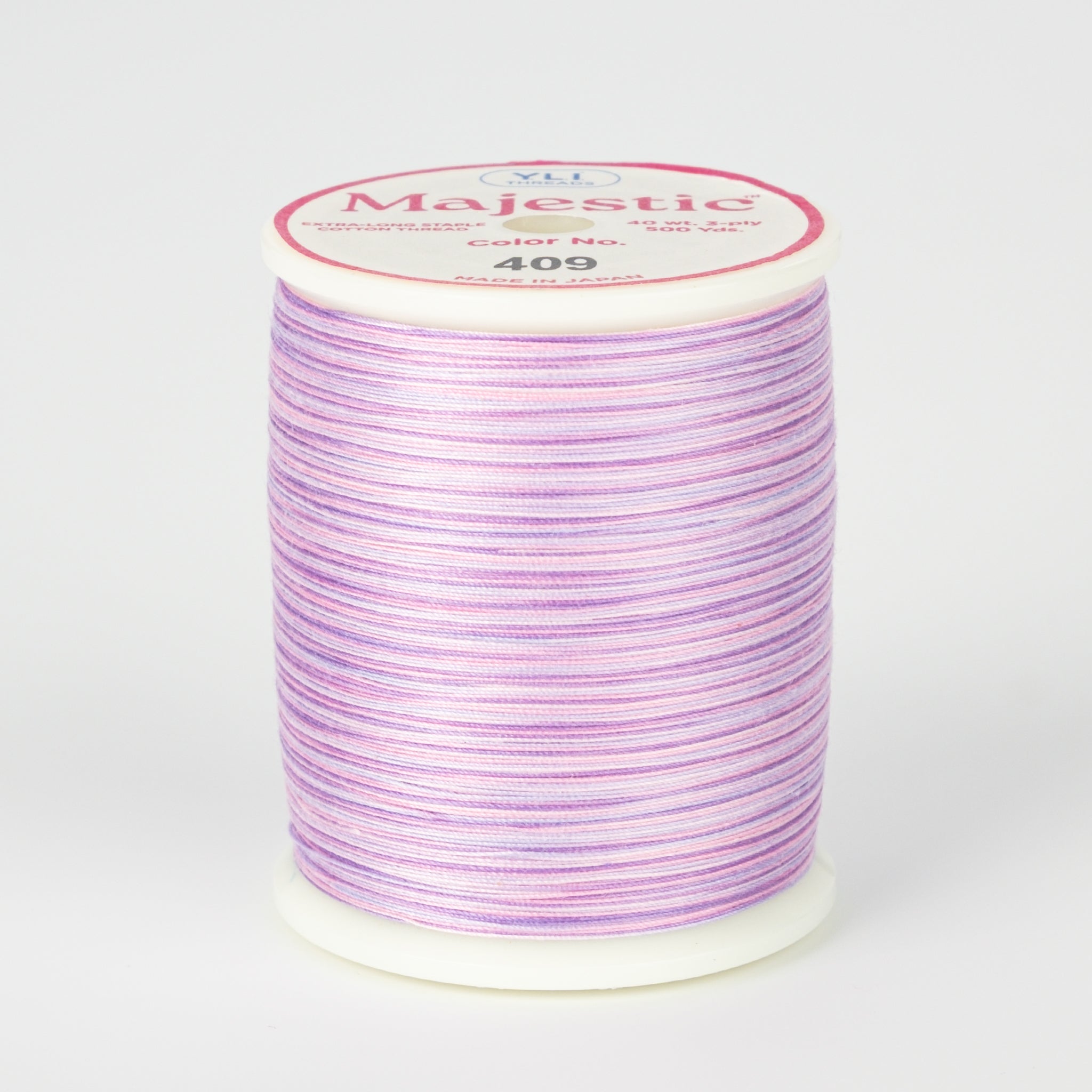 spool of majestic cotton quilting thread #409 wild orchid