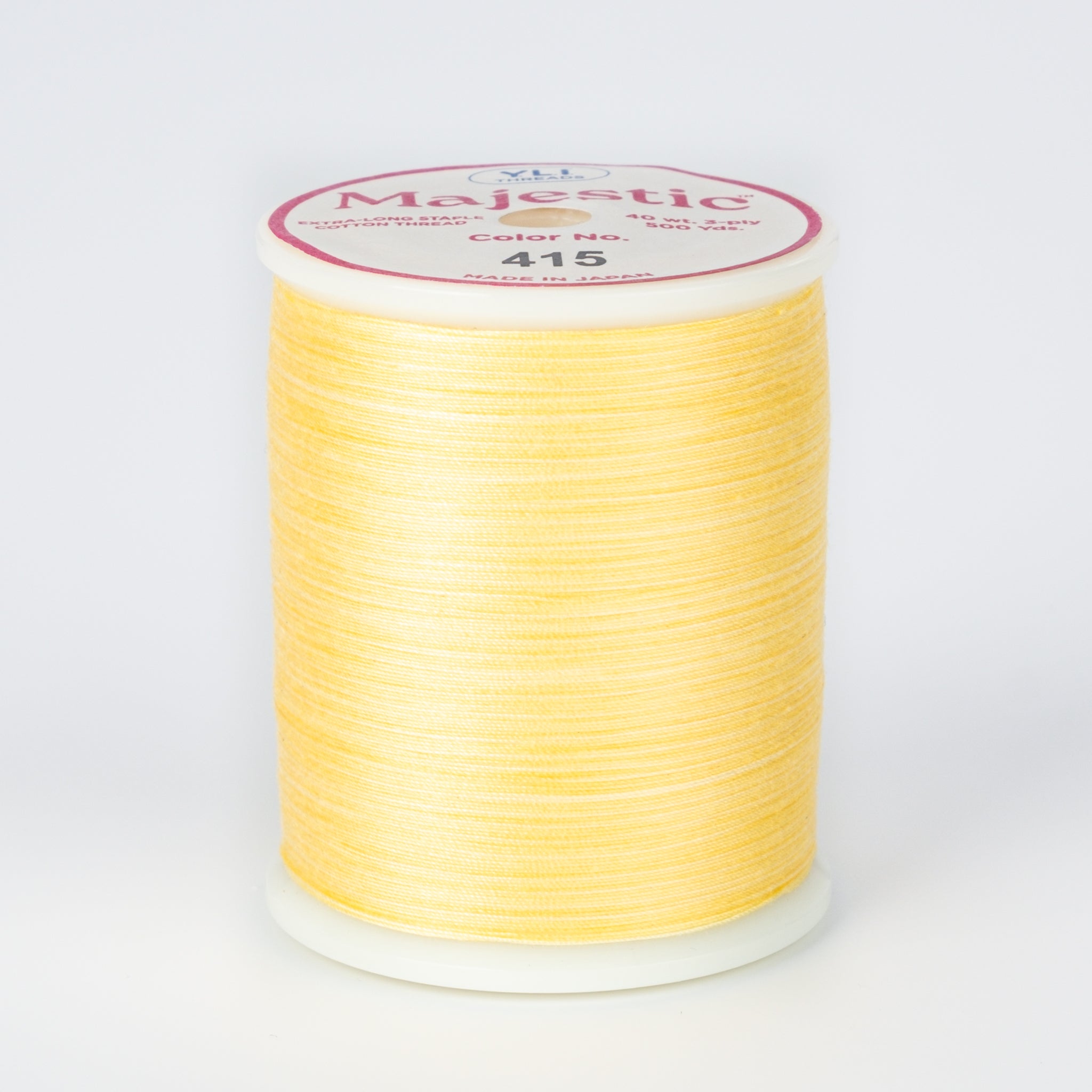 spool of majestic cotton quilting thread #415 lamplight