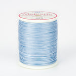 Light blue variegated Majestic thread on white spool with pink and white label showing color number 423