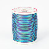 Multicolored variegated thread in blues and purples on white spool with Majestic label, color number 425