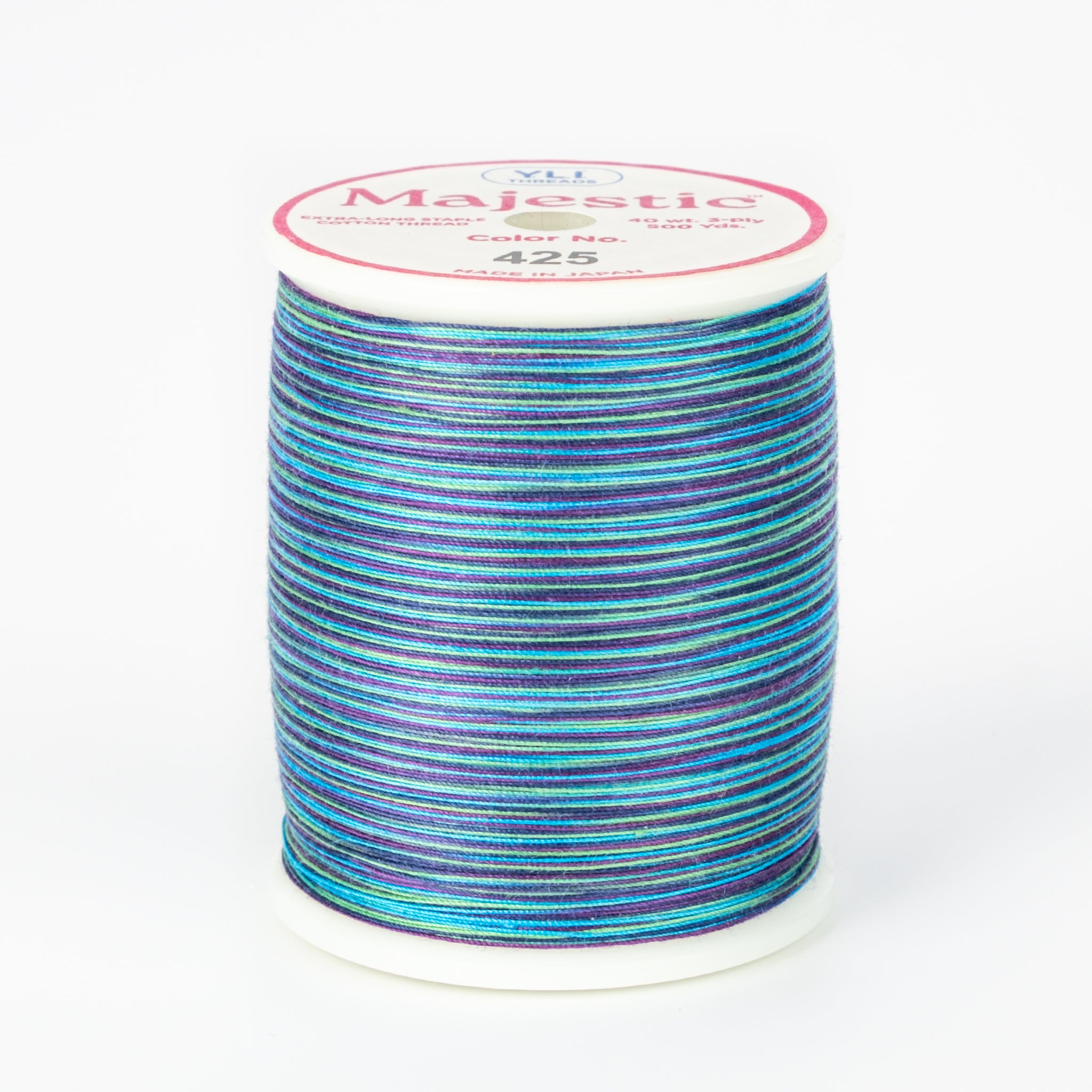 Multicolored variegated thread in blues and purples on white spool with Majestic label, color number 425