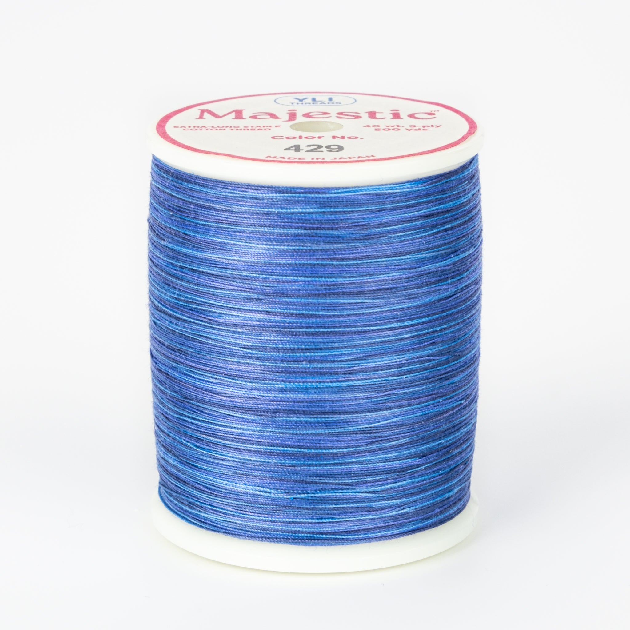 Blue variegated Majestic 40wt thread on white spool with pink and white label showing color number 429