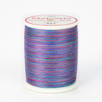 Multicolored variegated thread in blues, purples, and pinks on white plastic spool, Majestic brand, color 431 Treasure Hunt.