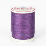 Purple and pink variegated Majestic thread on white spool with cream label showing color number 432
