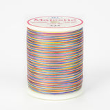 Rainbow variegated thread on white plastic spool with Majestic brand label, color number 434