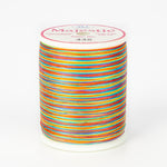 Multicolored variegated thread on white Majestic spool with bright rainbow stripes in orange, blue, pink, yellow