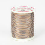 Cobblestone variegated thread on white spool with Majestic label, showing brown and gray multicolored pattern