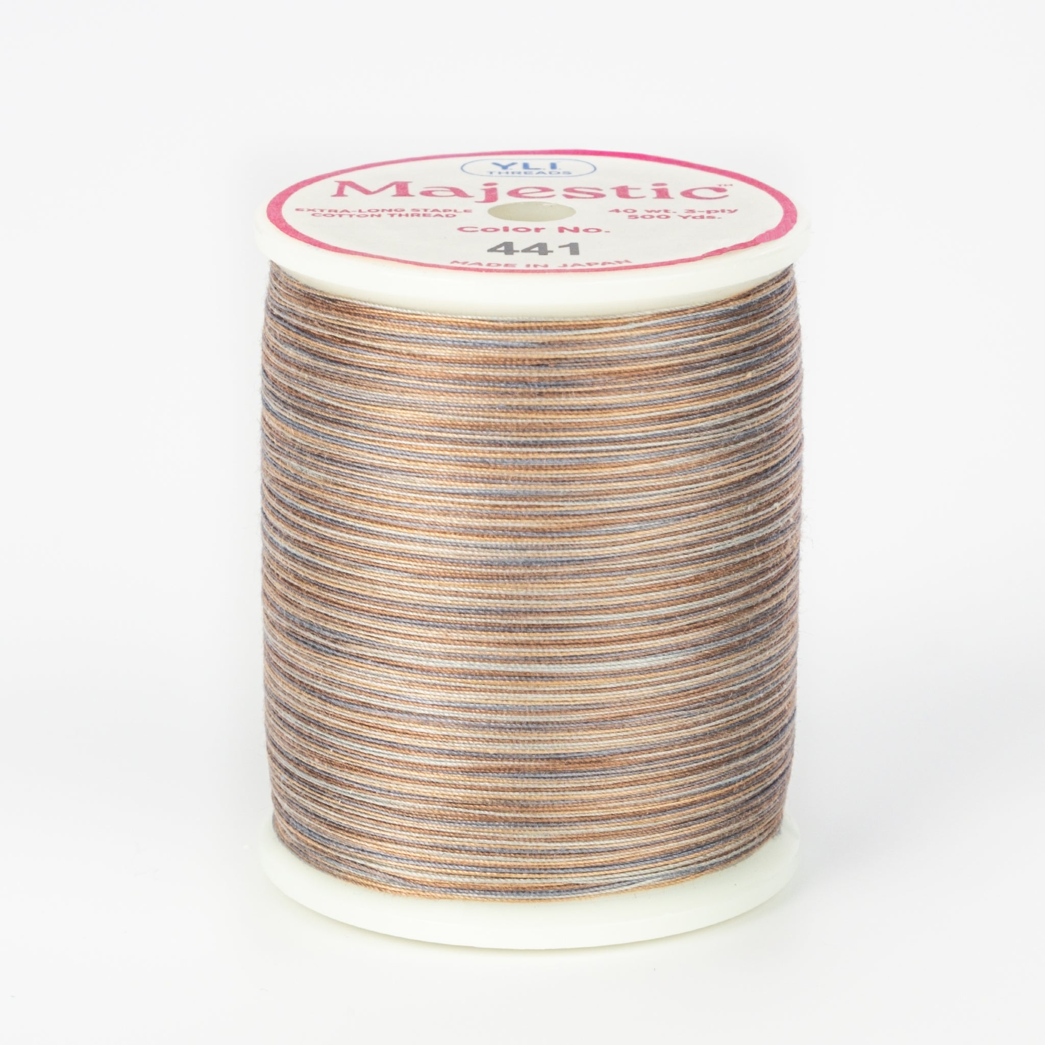 Cobblestone variegated thread on white spool with Majestic label, showing brown and gray multicolored pattern