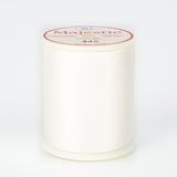 White Majestic thread on plastic spool with pink and white label showing Color No. 445