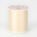 Cream colored Majestic 40 wt thread on white plastic spool with pink and white label showing color number 447