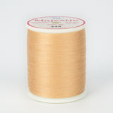 Almond colored thread wound on white plastic spool with Majestic brand label showing color number 448