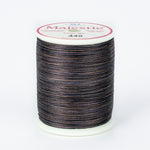 Dark variegated thread spool with navy, brown and gray tones on white plastic spool with Majestic label showing color 449