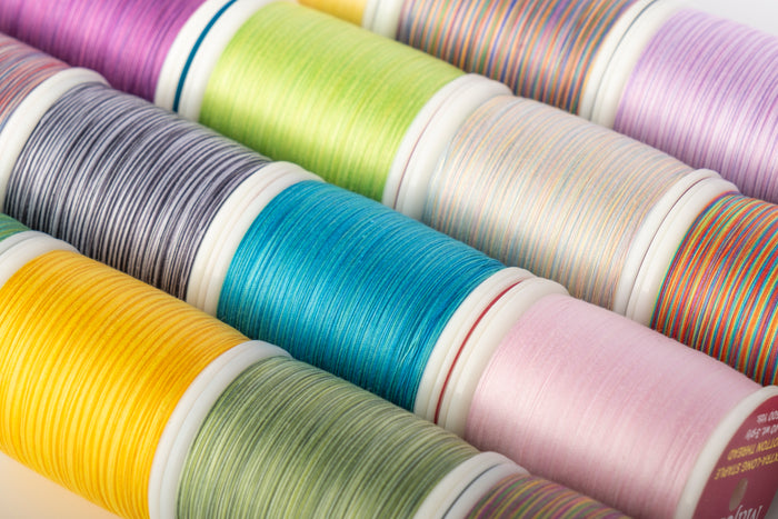 colorful spools of majestic quilting thread