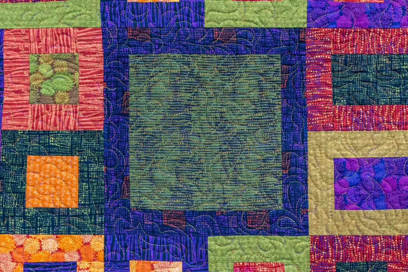 multi colored quilt block with detail quilting