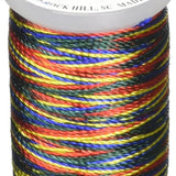 Multicolored variegated rayon thread on white mini cone spool with dark red, blue, yellow, and green stripes.