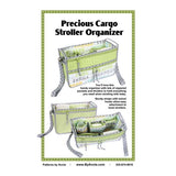 Green and white stroller organizer sewing pattern showing a rectangular bag with multiple pockets and adjustable straps for stroller attachment.