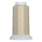Stepping stone beige thread wound on white plastic cone spool against white background