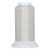 Off-white thread wound on white plastic cone spool with wide base