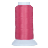 Pink thread wound on white plastic cone spool against white background