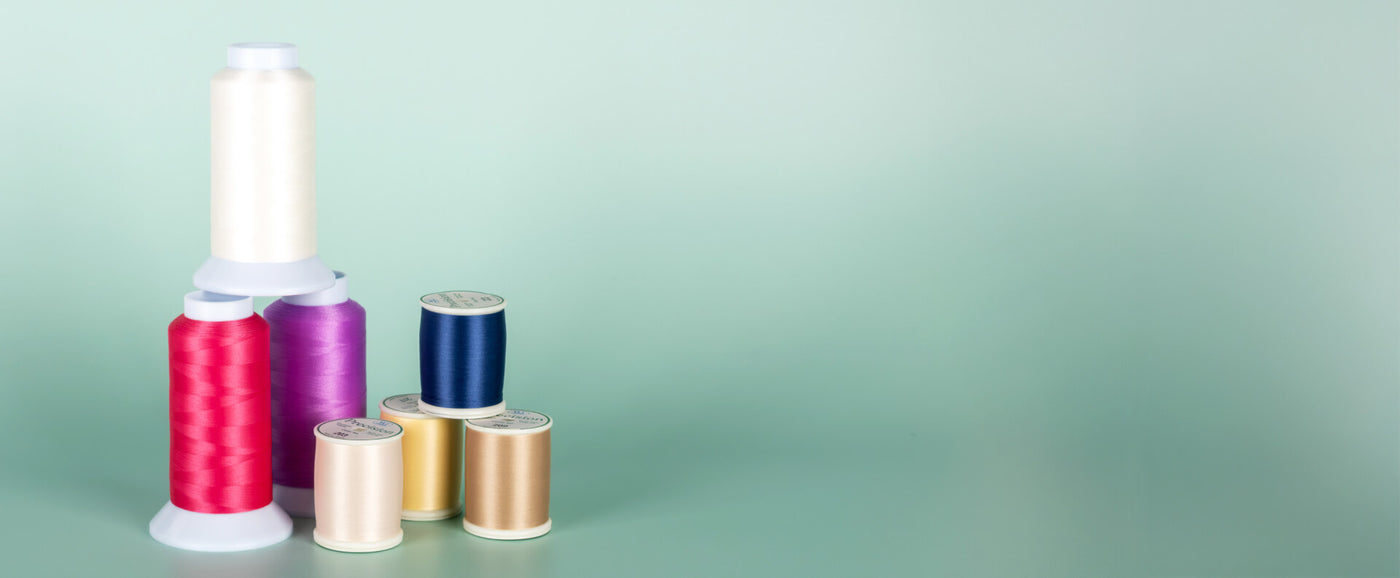 cones and spools of precision 60 wt. polyester thread