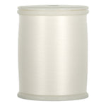White thread spool with smooth, glossy finish and plastic end caps