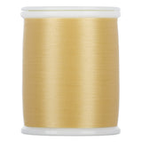 Light gold thread wound on white plastic spool with smooth, lustrous finish