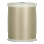 Flagstone beige thread wound on white plastic spool with visible thread texture and smooth finish