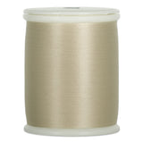 Flagstone beige thread wound on white plastic spool with visible thread texture and smooth finish