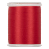Red thread wound on white plastic spool with smooth, even wrapping and glossy finish