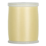 Light yellow thread wound on white plastic spool with clear plastic ends