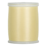 Light yellow thread wound on white plastic spool with clear plastic ends
