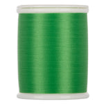 Green sewing thread wound on white plastic spool with clear top and bottom caps