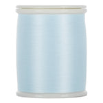 Light blue thread wound on white plastic spool with clear plastic ends