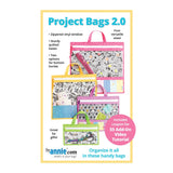 Colorful quilted project bags in four sizes with vinyl windows, featuring floral and animal print fabrics with bright handles and trim.