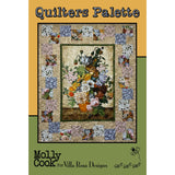 A floral quilt pattern featuring a large central bouquet surrounded by colorful patchwork squares in blues, pinks, and earth tones.