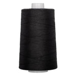 Black quilting thread wound on white plastic cone
