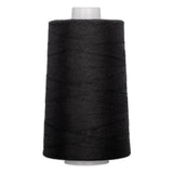 Black quilting thread wound on white plastic cone