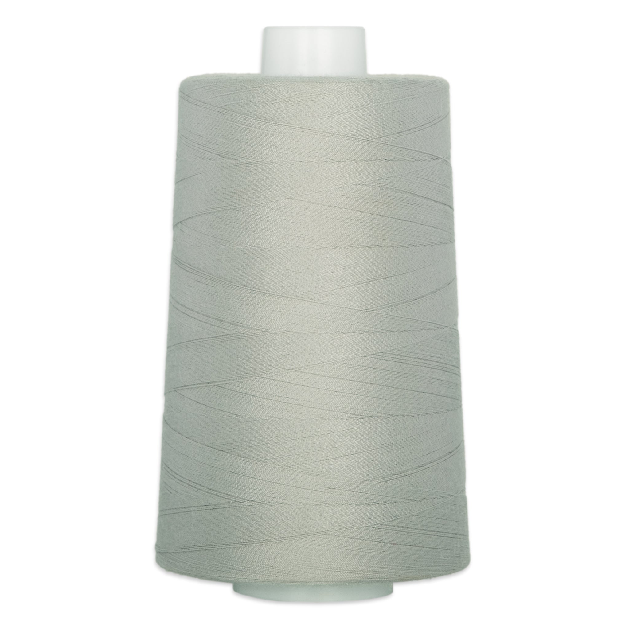 Light sage green thread wound on a white plastic cone spool